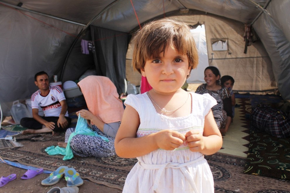 Some of the 12,000 Iraqi Yazidi refugees that arrived at Newroz camp in Al-Hassakah province, north eastern Syria after fleeing Islamic State militants. The refugees had walked up to 60km in searing temperatures through the Sinjar mountains and many had suffered severe dehydration.  Photo credit: UK Department for International Development, Flickr